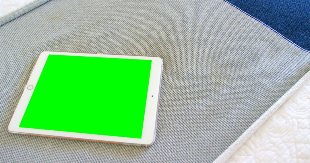 Digital Tablet with Green Screen on Textured Surface - Free Images, Stock Photos and Pictures on Pikwizard.com