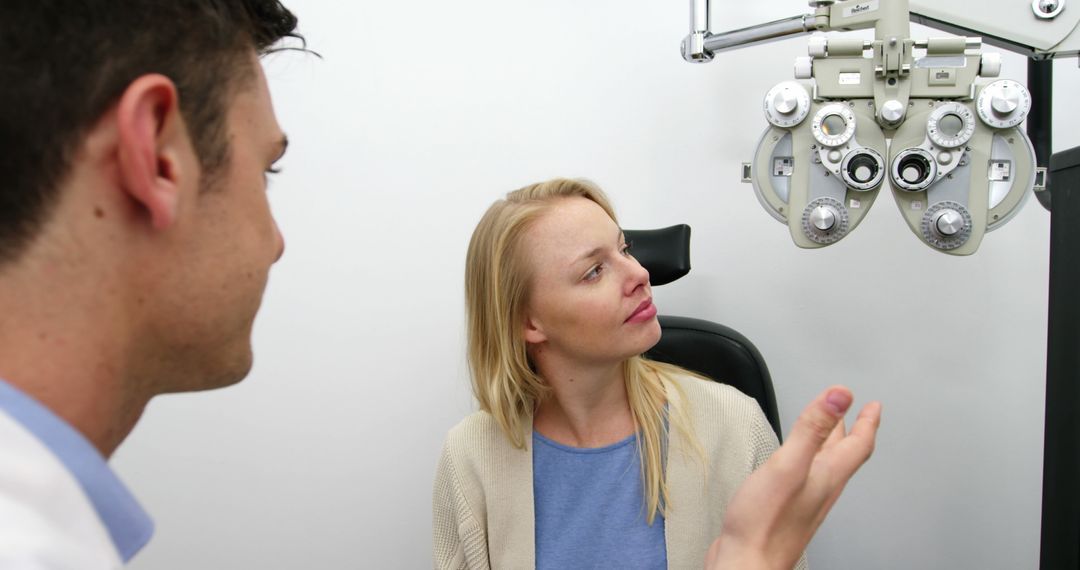 Eye Doctor Consulting Female Patient During Eye Exam - Free Images, Stock Photos and Pictures on Pikwizard.com