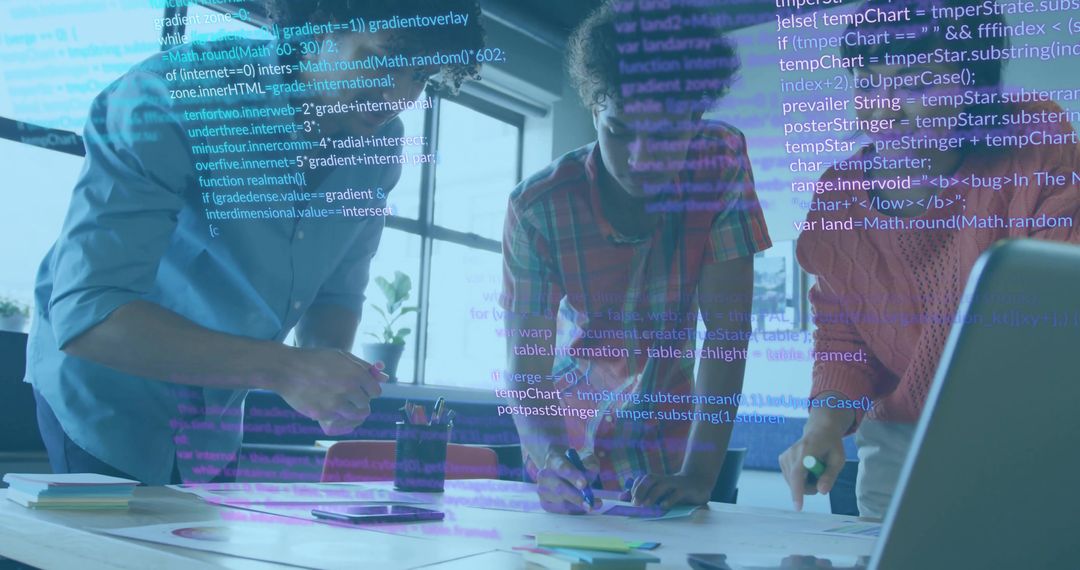 Young Professionals Developing Software Together in Modern Workspace