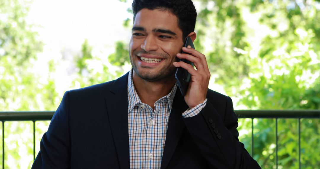 Confident Businessman Having Phone Conversation Outdoors - Free Images, Stock Photos and Pictures on Pikwizard.com