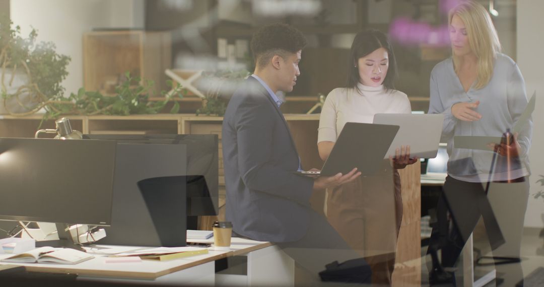Diverse Business Team in Modern Office Collaborating on Project
