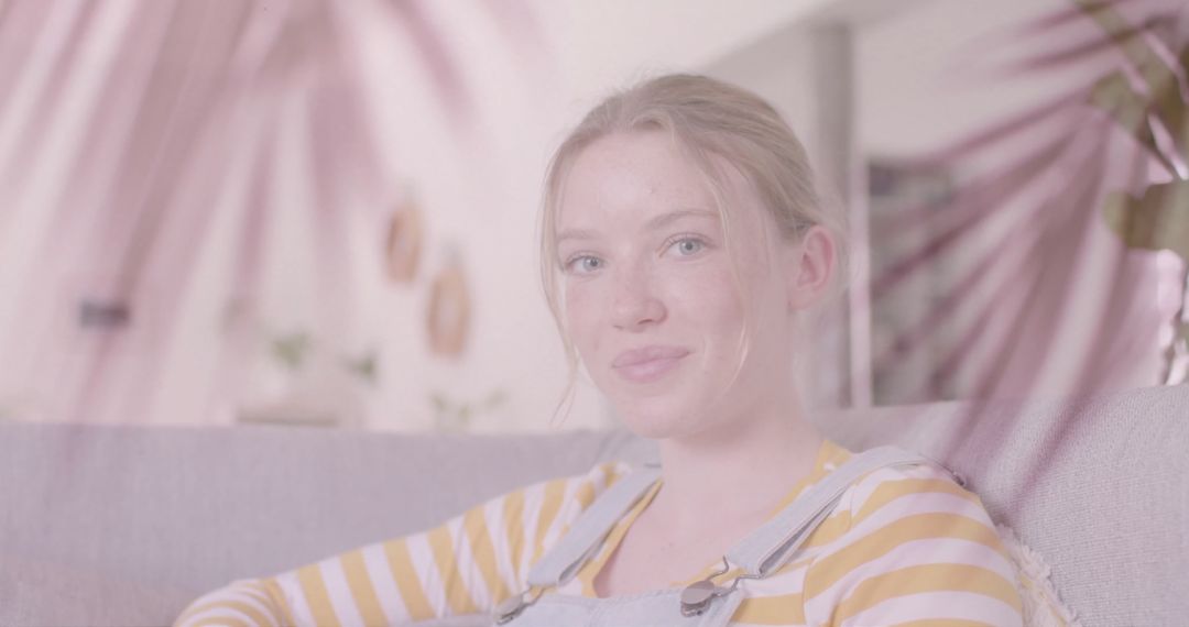 Teenage Girl Relaxing at Home with Soft Palm Leaves Overlay