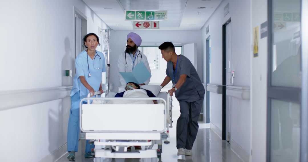 Medical Team Rushing Patient on Gurney in Hospital Hallway - Free Images, Stock Photos and Pictures on Pikwizard.com