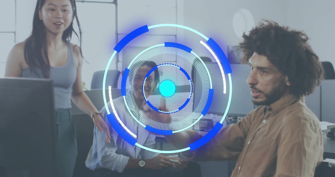 Collaborating team in modern open-plan office with futuristic blue HUD overlay and screens