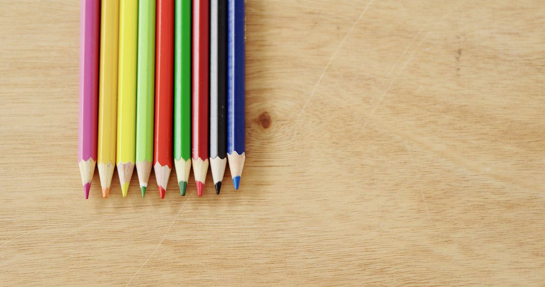 Colorful Pencils Aligned on Wooden Surface - Free Images, Stock Photos and Pictures on Pikwizard.com