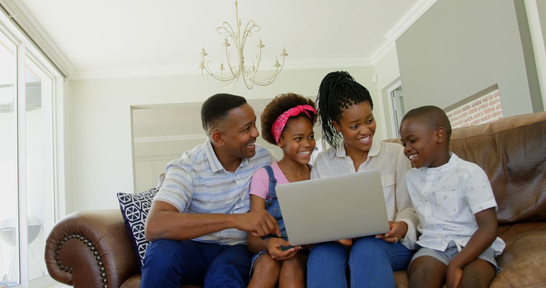 Happy African American Family Using Laptop at Home - Free Images, Stock Photos and Pictures on Pikwizard.com