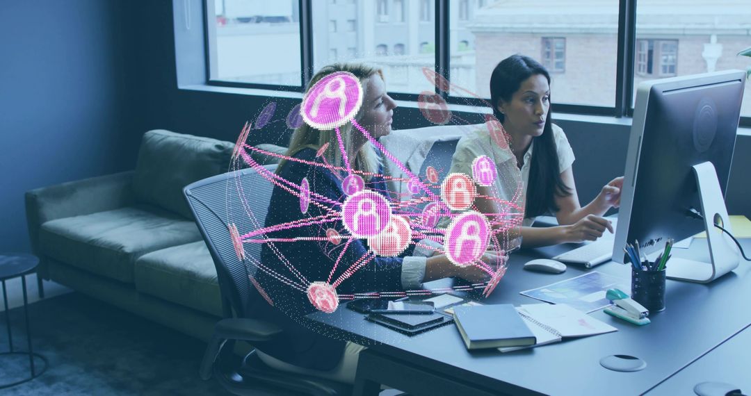 Two Women Collaborating at Office Desk with Holographic Network Visualizing Team Connectivity