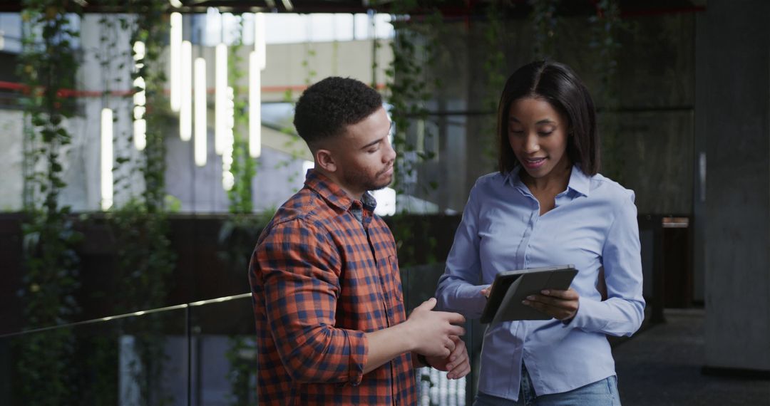 Diverse Colleagues Collaborating with Tablet