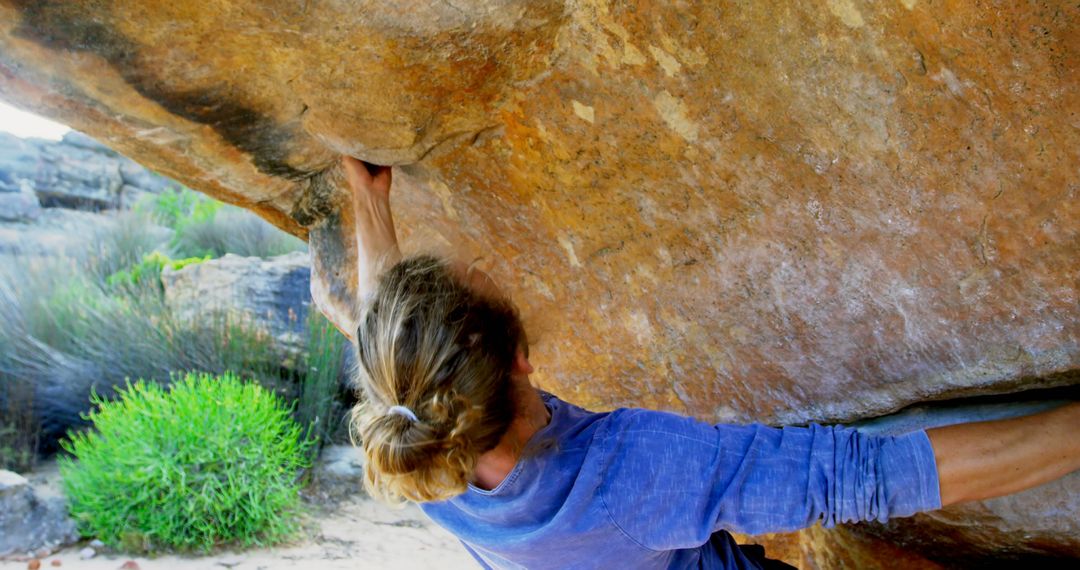 Person Rock Climbing on Large Boulder Outdoors - Free Images, Stock Photos and Pictures on Pikwizard.com