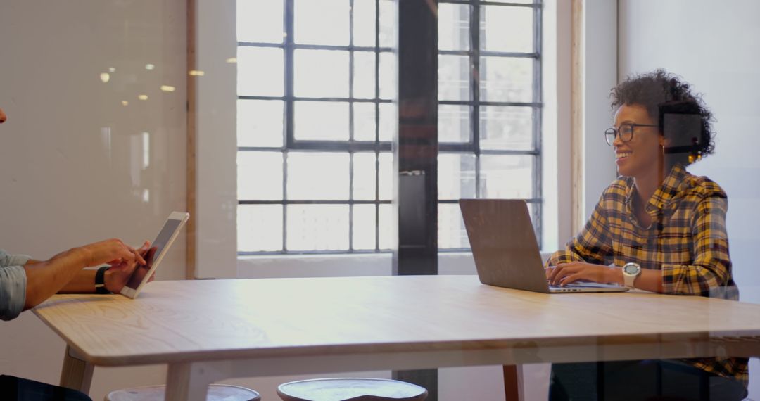Colleagues Collaborating with Digital Devices in Office Setting