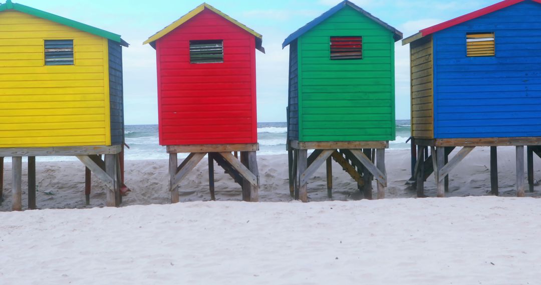 Multicolored Beach Huts on Sandy Shore Wave Background - Free Images, Stock Photos and Pictures on Pikwizard.com