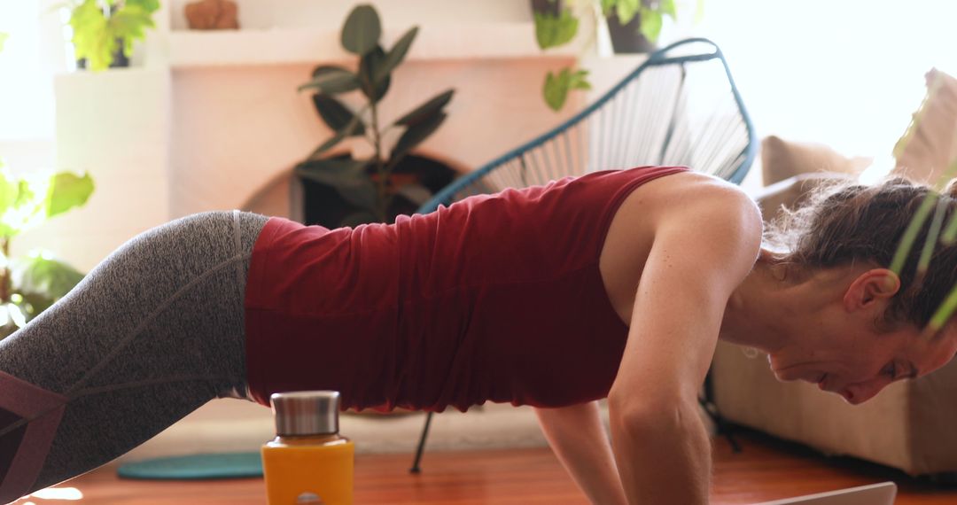 Woman Exercising at Home Doing Push-ups - Free Images, Stock Photos and Pictures on Pikwizard.com