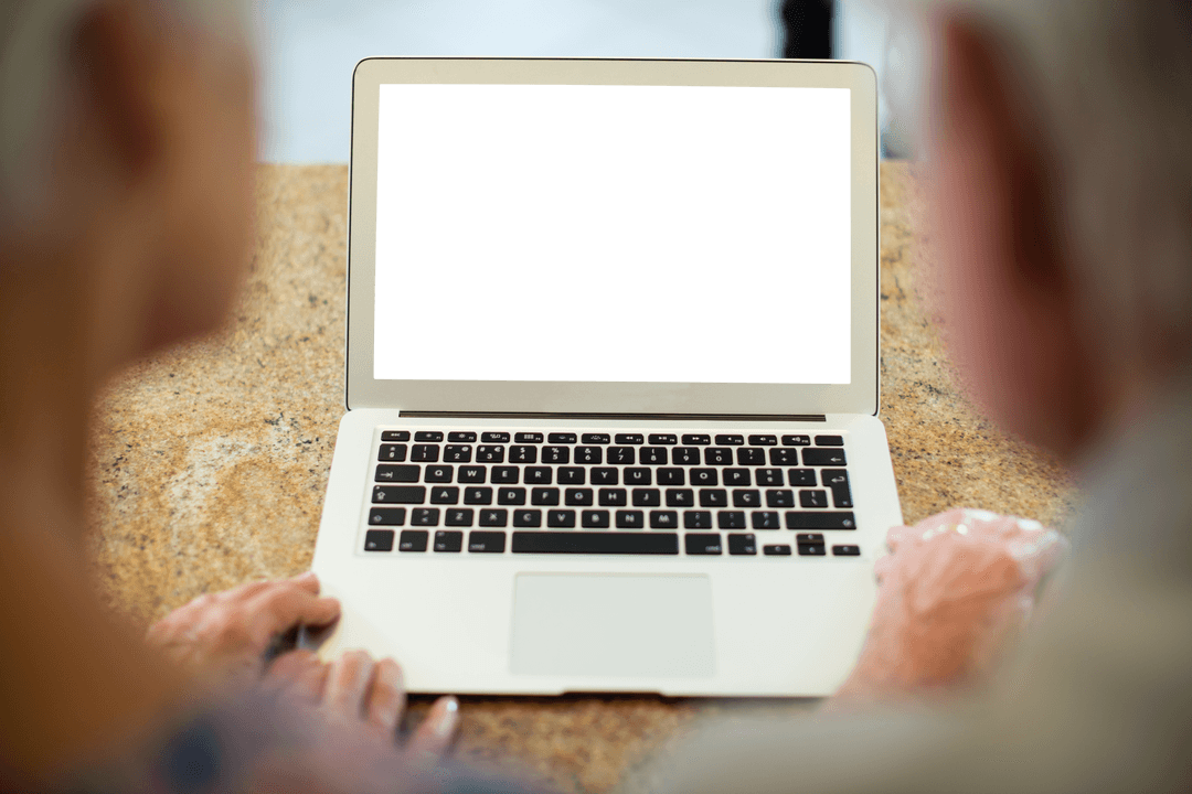 Elderly Couple Using Laptop with Transparent Screen at Home