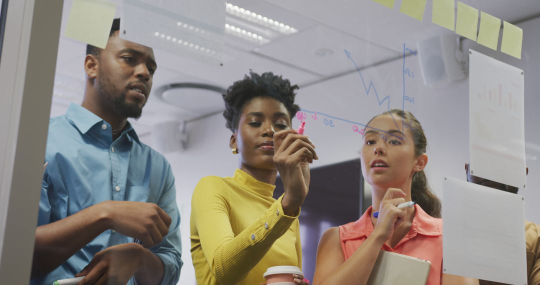 Diverse Team Collaborating on Business Strategy in Bright Office