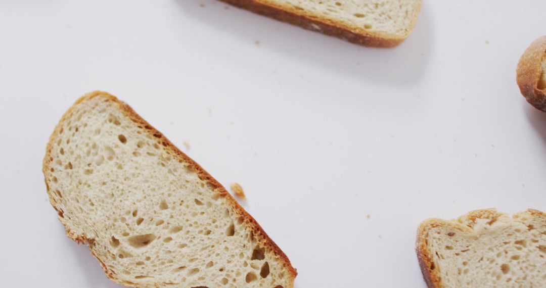 Slices of Rustic Bread on White Background