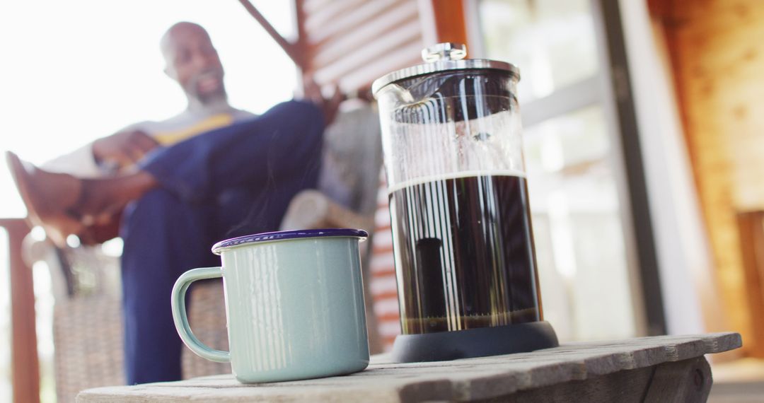 Relaxing Weekend Morning with French Press Coffee on Porch - Free Images, Stock Photos and Pictures on Pikwizard.com