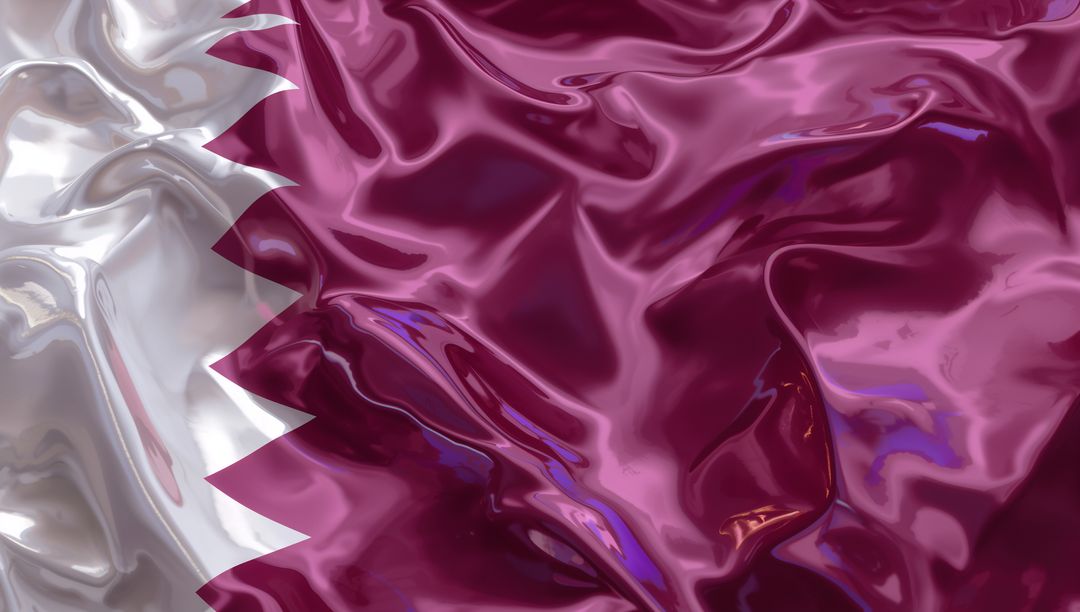 Glossy Qatar Flag Fabric Close-Up Showing Maroon Field and White Serrated Nine-Point Band
