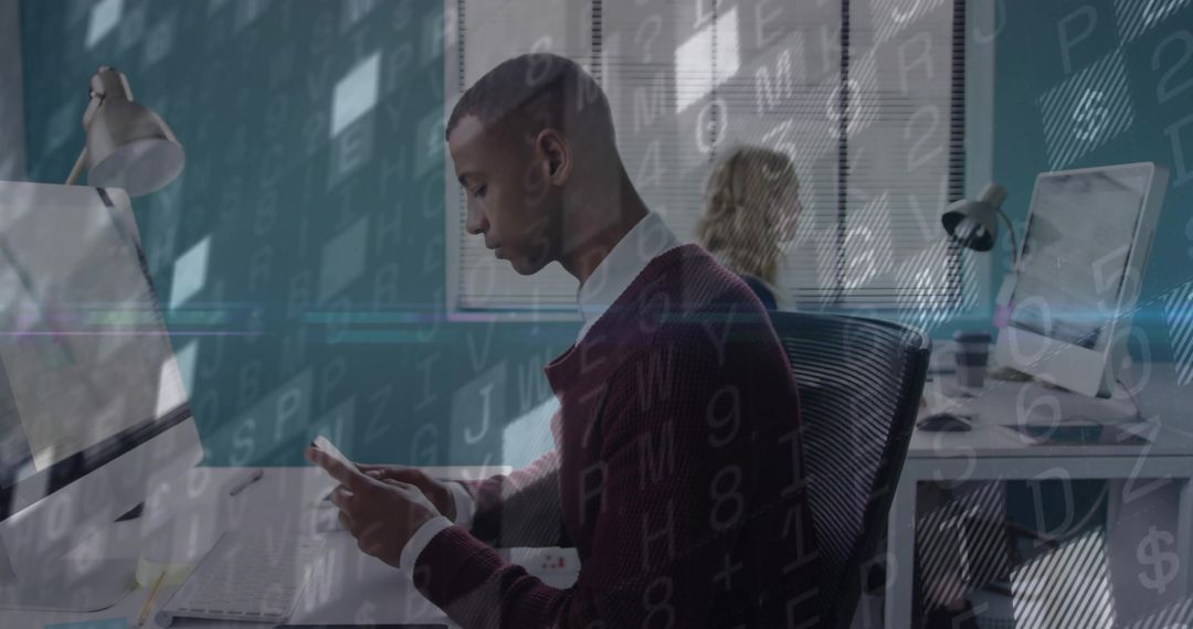African American Professional Engaging with Technology at Office Desk