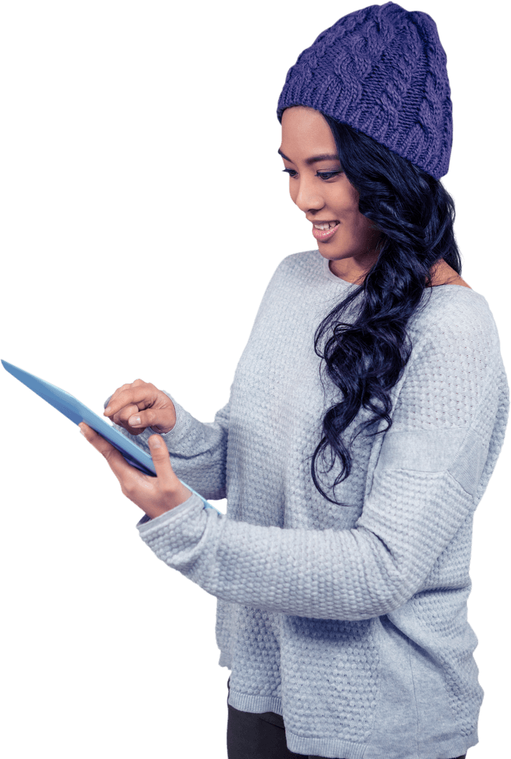 Asian Woman Engaging with Tablet Using Hand Touching Screen Wearing Warm Sweater