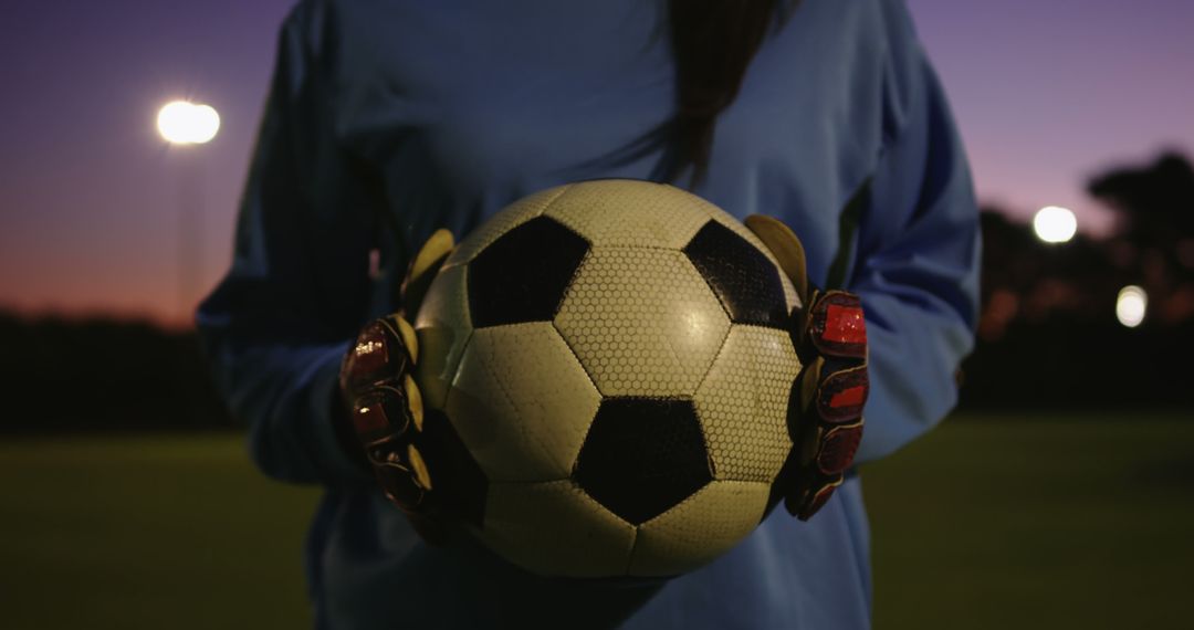 Mid section of female football goal keeper holding ball on field, unaltered with copy space - Free Images, Stock Photos and Pictures on Pikwizard.com