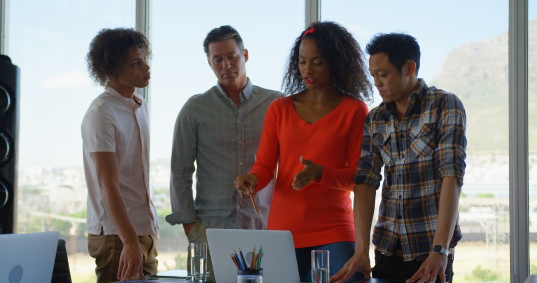 Diverse Team Collaborating in Modern Office Gathering Space