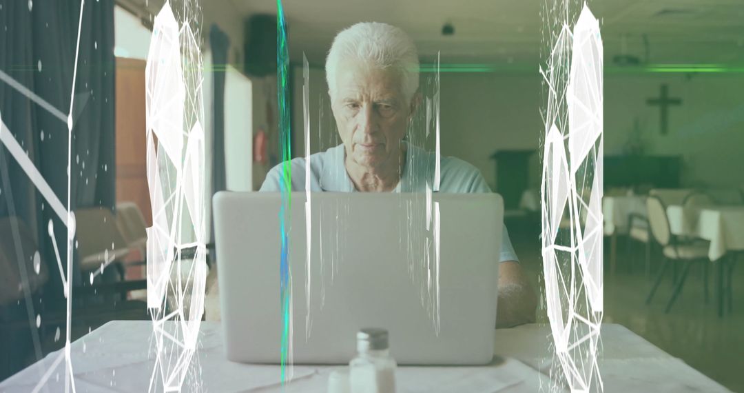 Elderly Man Using Laptop in Church Community Hall