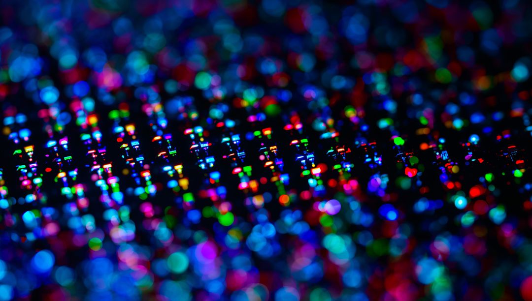 Shimmering Holographic Foil Scattering Light Macro with Prismatic Bokeh and Pixelated Grid