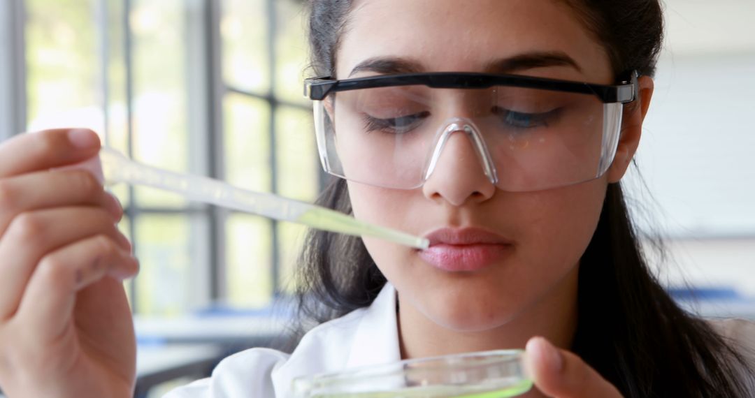 Science Student in Laboratory Conducting Experiment - Free Images, Stock Photos and Pictures on Pikwizard.com