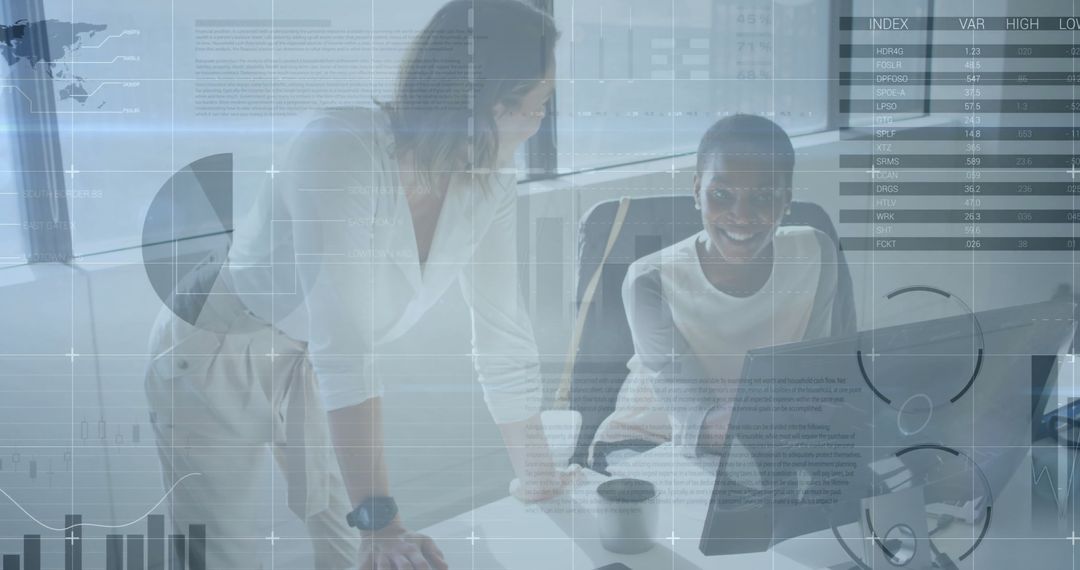 Two Women Analyzing Financial Data on Computer in Modern Office