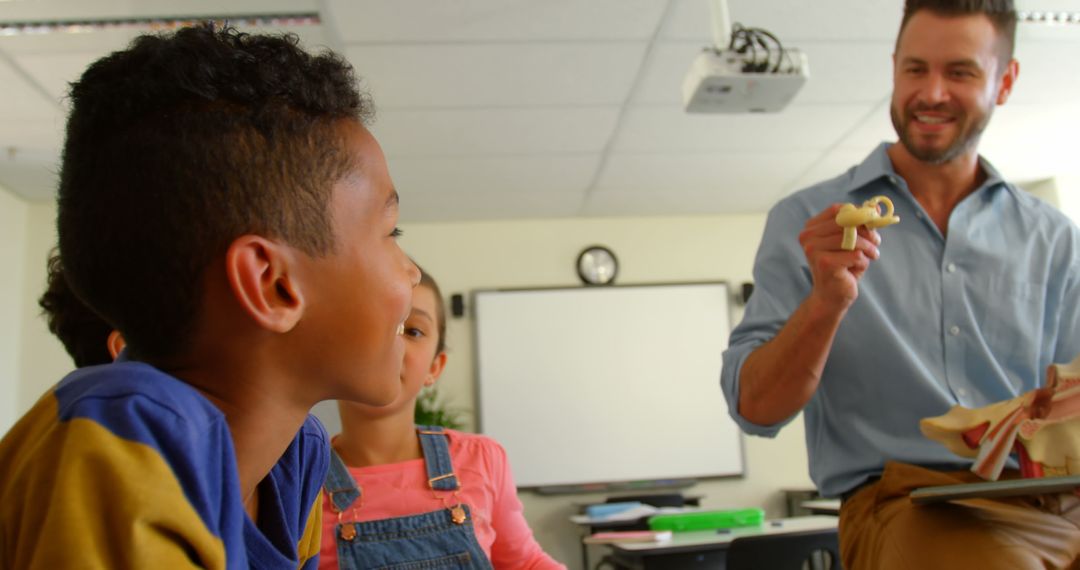 Teacher Explaining Anatomy to Engaged Students in Classroom
