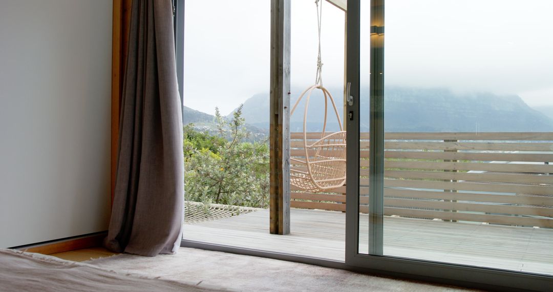 Minimalist Room with Wicker Chair and Mountain View