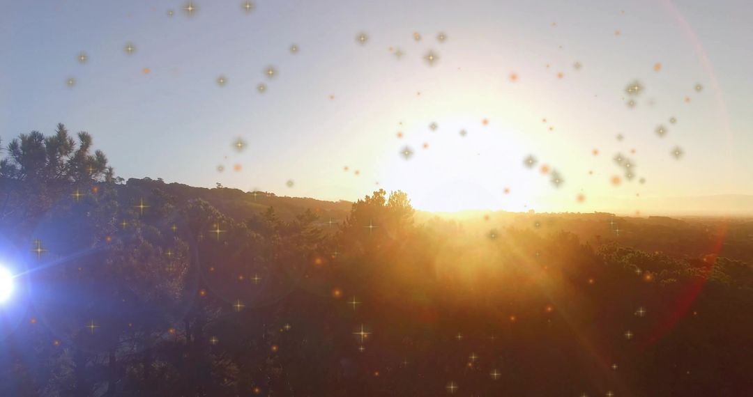 Magical Sunset Over Rolling Hills with Glowing Sparkles