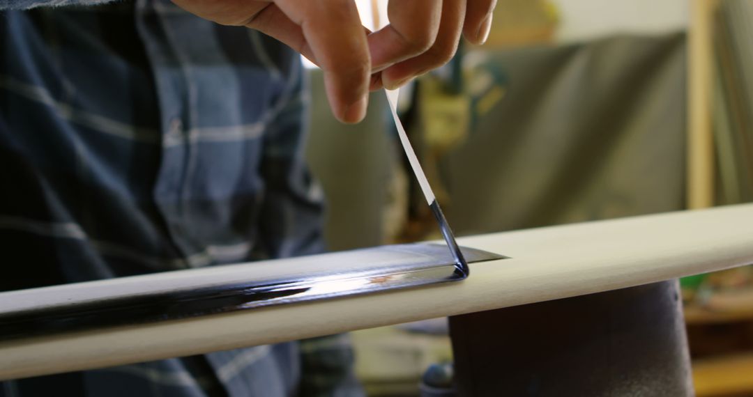 Close-Up of Person Applying Resin to Surfboard for Custom Finishing - Free Images, Stock Photos and Pictures on Pikwizard.com