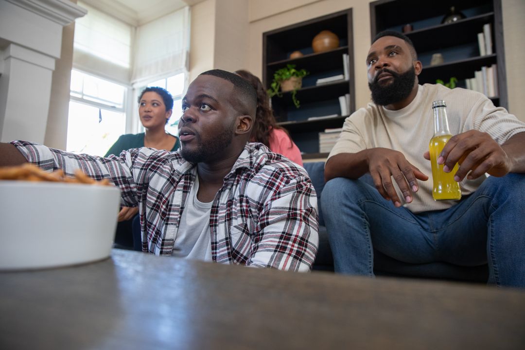 Diverse Friends Enjoying a Casual TV Watch Party at Home