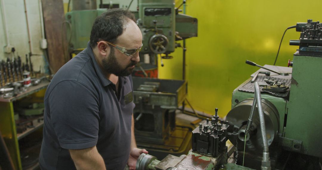 Industrial Worker Operating Lathe Machine in Workshop - Free Images, Stock Photos and Pictures on Pikwizard.com