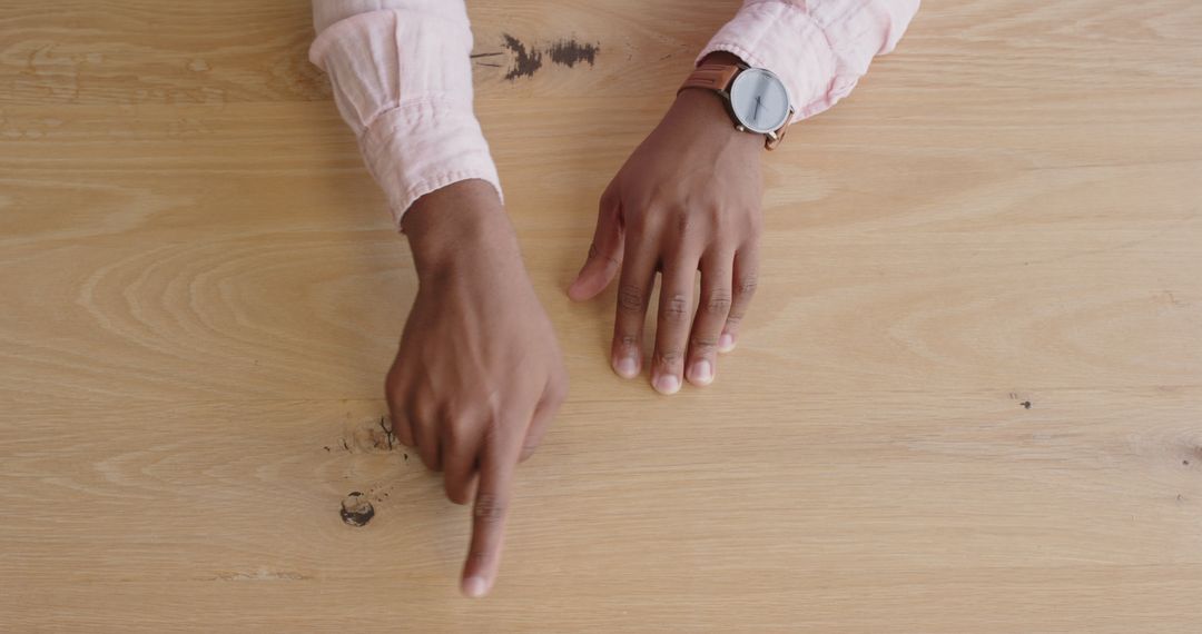 Hands Expressing Ideas During Discussion on Wooden Table