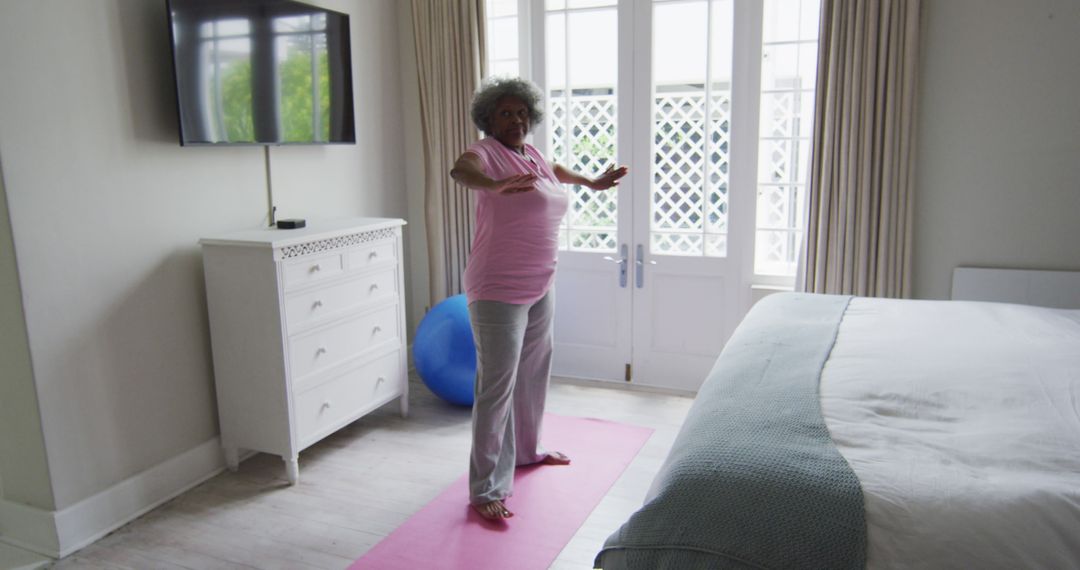 Senior Woman Practicing Yoga at Home for Wellness - Free Images, Stock Photos and Pictures on Pikwizard.com