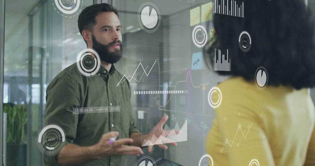 Colleagues Analyzing Financial Data with Advanced Technology