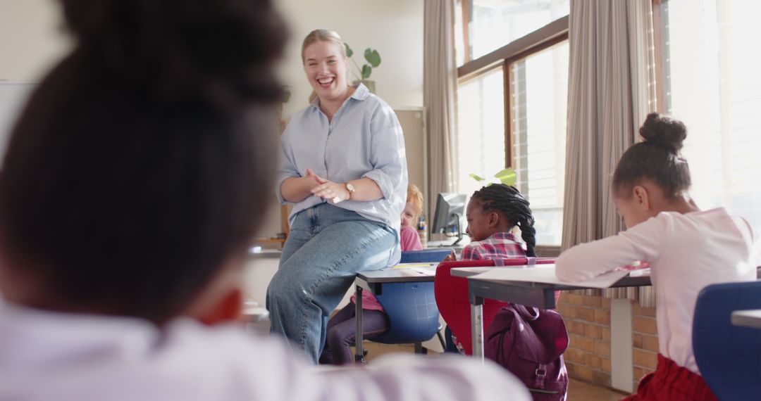 Engaging Teacher Interacting with Elementary Students in Classroom