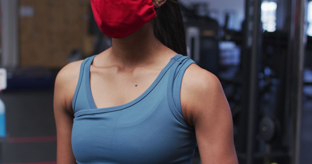 Woman Exercising in Gym Wearing Protective Face Mask - Free Images, Stock Photos and Pictures on Pikwizard.com