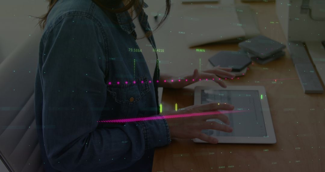 Woman Using Digital Tablet with Financial Graphs at Office
