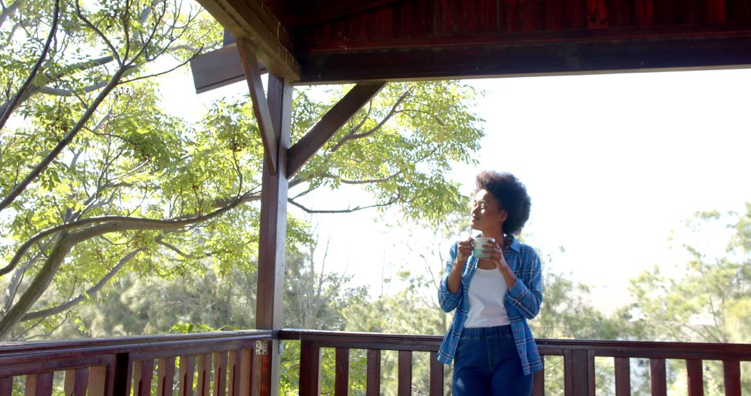 Woman Relaxing on Balcony with Coffee on Sunny Morning - Free Images, Stock Photos and Pictures on Pikwizard.com