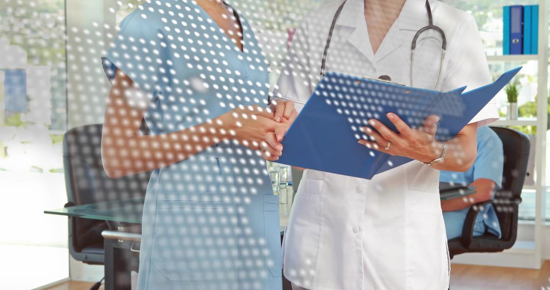 Doctor and Nurse Reviewing Patient File in Clinic Office, Stethoscope, Teamwork
