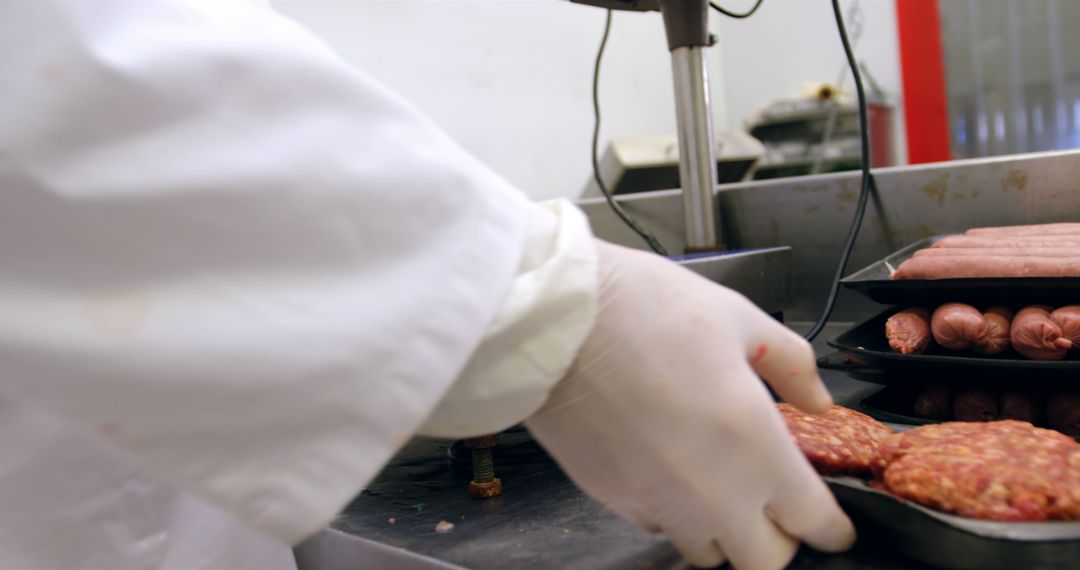 Butcher Handling Minced Meat and Sausage Trays - Free Images, Stock Photos and Pictures on Pikwizard.com