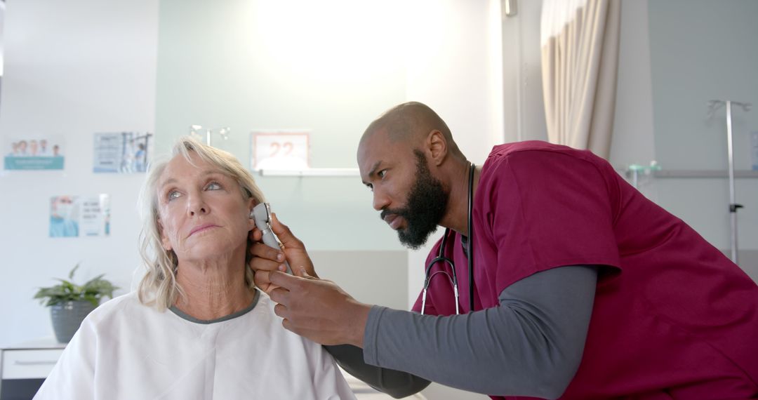 Doctor Examining Woman's Ear in Hospital Room - Free Images, Stock Photos and Pictures on Pikwizard.com