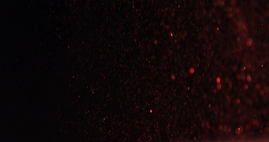 Red particles are scattered in a dynamic, dark background, with copy space - Free Images, Stock Photos and Pictures on Pikwizard.com