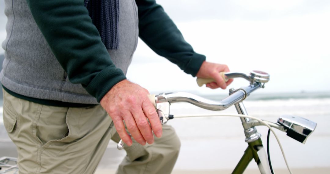 Senior Man Walking with Bicycle on Beach - Free Images, Stock Photos and Pictures on Pikwizard.com