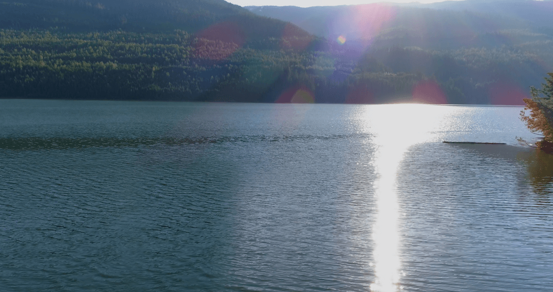 Landscape with Transparent Sunlight on River by Mountain Peak