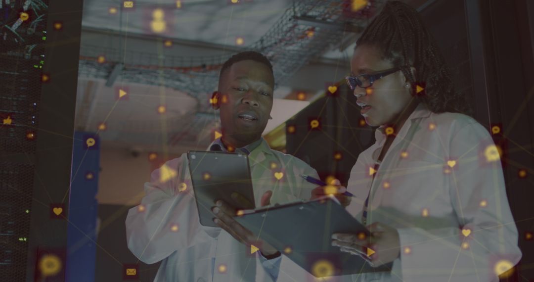 Engineers Analyzing Data Network Connections in Server Room