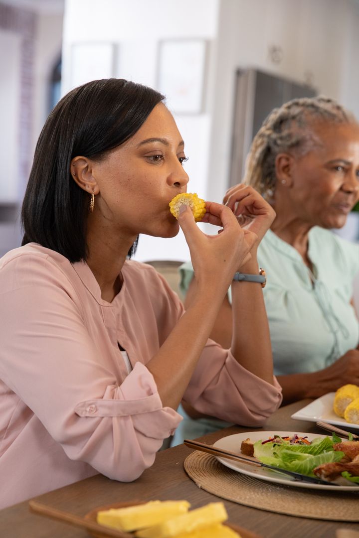 Mother and Daughter Enjoying Meal Together at Home